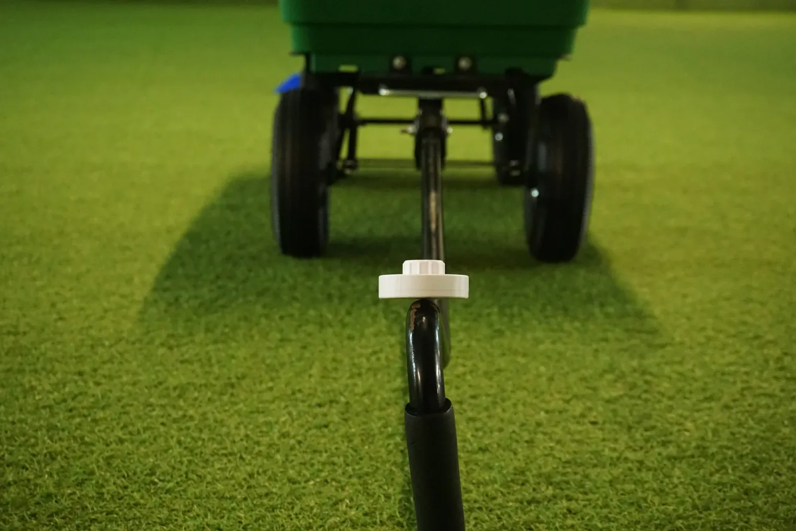 Garden wagon seen from behind, with a white scent container on the tow bar